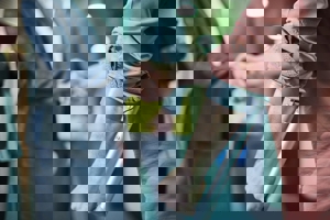 Person using a crutch after a work injury